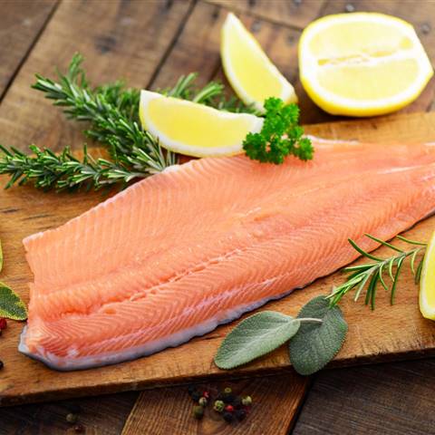 Fish fillet with lemons on a cutting board